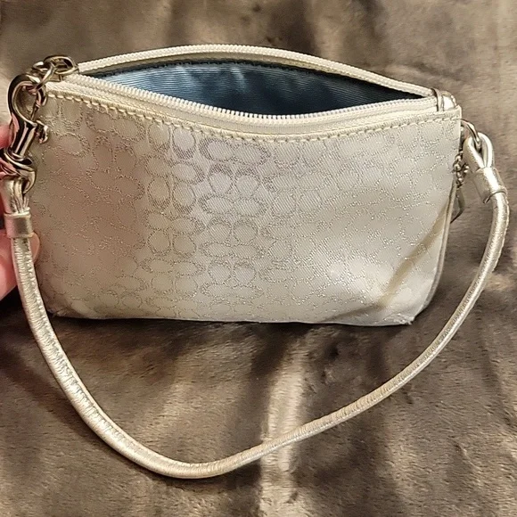 Elegant Coach White and Silver Wristlet